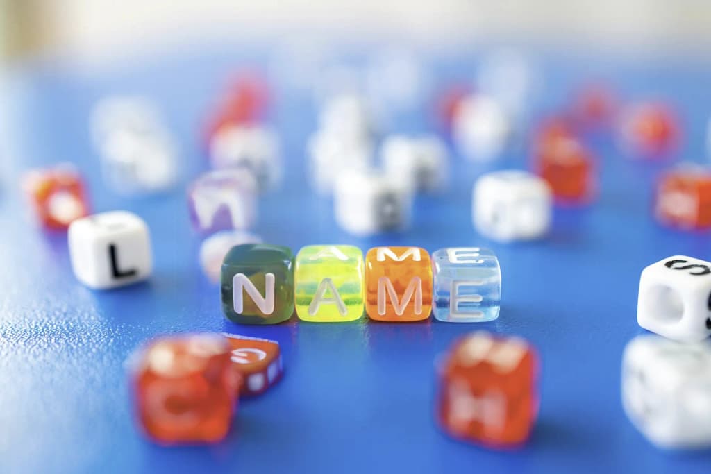 Cubes spelling out 'Name' as a metaphor for naming ideas